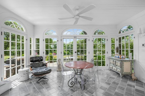 Settle in for quiet afternoons in the sunroom looking out across the grounds
