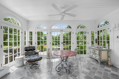 Settle in for quiet afternoons in the sunroom looking out across the grounds
