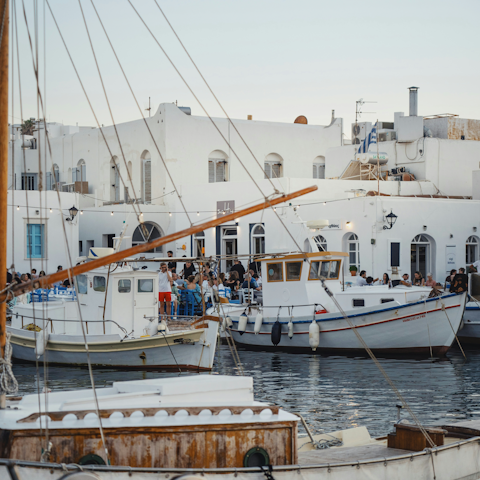 Wander the streets of Naousa, the heart of Paros