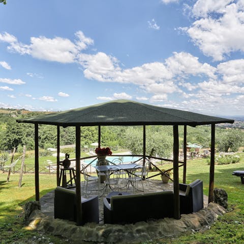 Enjoy incredible views while sipping drinks in the garden