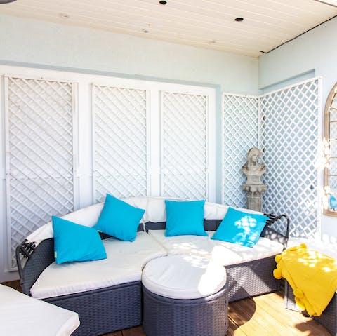 Curl up on the outdoor seating to sip drinks and curl up with a good book