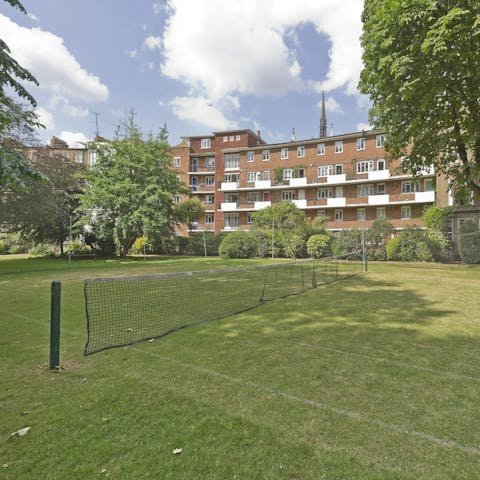 Enjoy a game of doubles on the communal tennis court