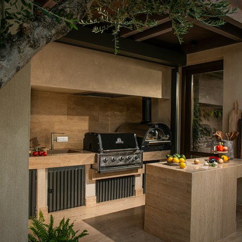 Fire up the grill in the outdoor kitchen for alfresco dinners