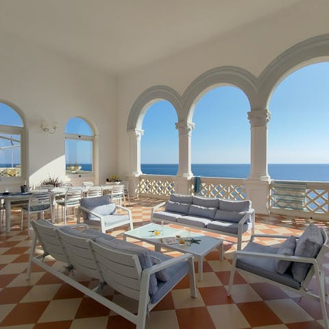 Lounge in luxury on the covered outdoor patio, the perfect spot for an afternoon aperitivo