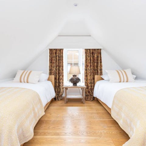 Cosy up in the mezzanine bedroom in the rafters