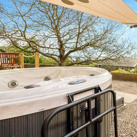 Soak in the private hot tub and take in the views