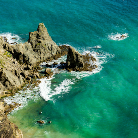 Explore the dramatic coastline around Praia da Luz