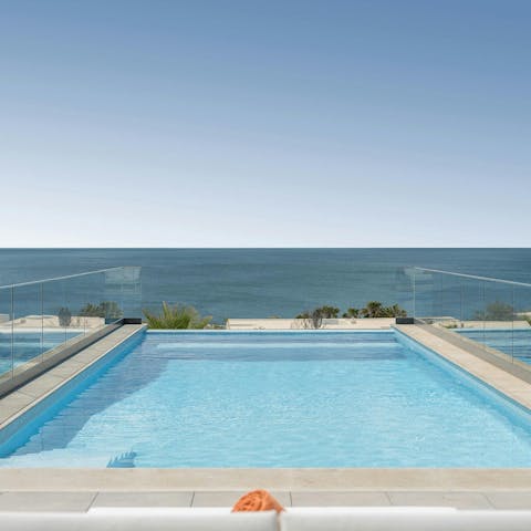 Swim against a backdrop of spectacular sea views