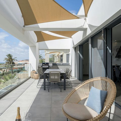Enjoy breakfast, barbecues, and cocktails on the terrace