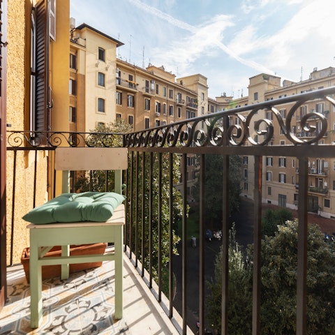 Relax on the balcony in the Rome sun and take in the views over the communal garden