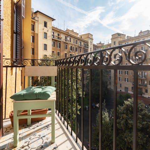 Relax on the balcony in the Rome sun and take in the views over the communal garden