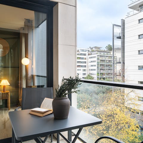 Enjoy a glass of wine from the private balcony