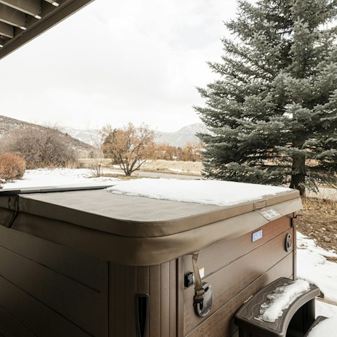 Enjoy the mountain views while soaking in the hot tub