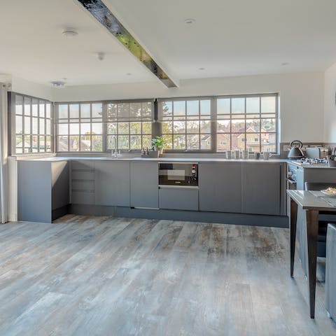 Knock up a hearty meal in the sleek, light-filled kitchen