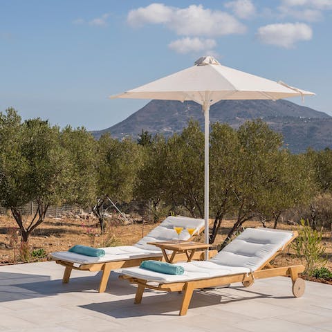 Sunbathe while admiring the mountain views