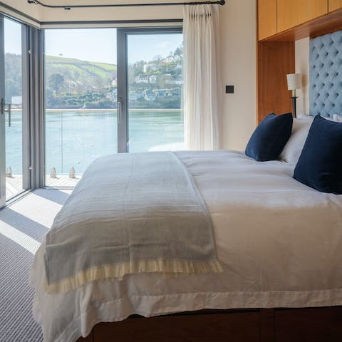 Wake up to wraparound river views