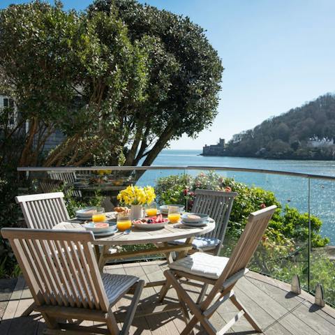 Enjoy an alfresco meal overlooking the River Dart