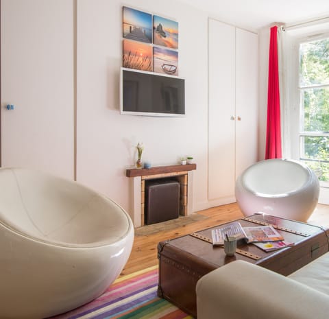 The pair of funky egg armchairs