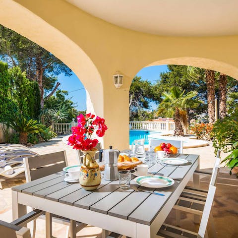 Dine poolside on pincho ribs and smoky paella fresh off the barbecue