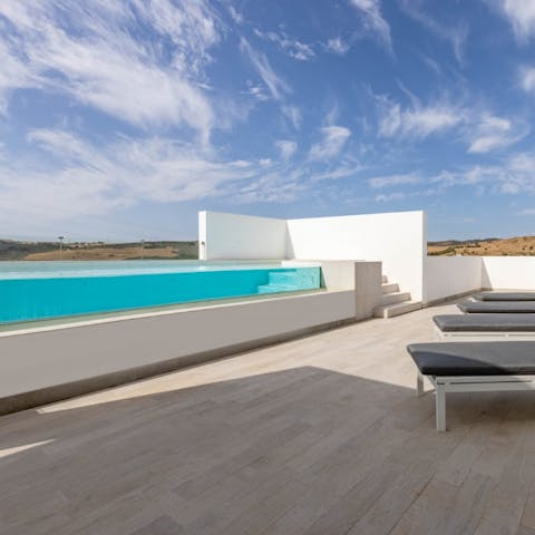 Make sunset dips in your private infinity pool part of your new routine