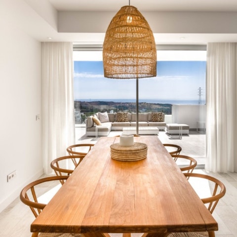 Lay the table for atmospheric evening meals with a sea view