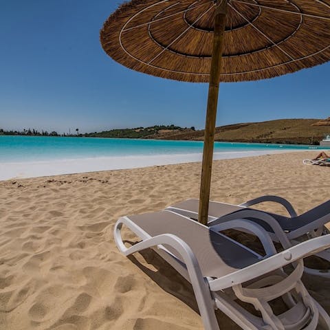 Flip-flop down to the onsite lagoon beach for a change of scene