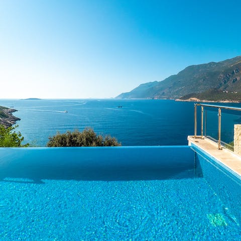 Paddle in the villa's infinity pool and admire the scenery