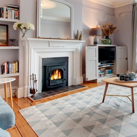 Curl up by the fire in the living room after a dip in the sea