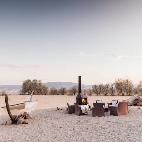 Gather around the fire for sunset drinks and star gazing