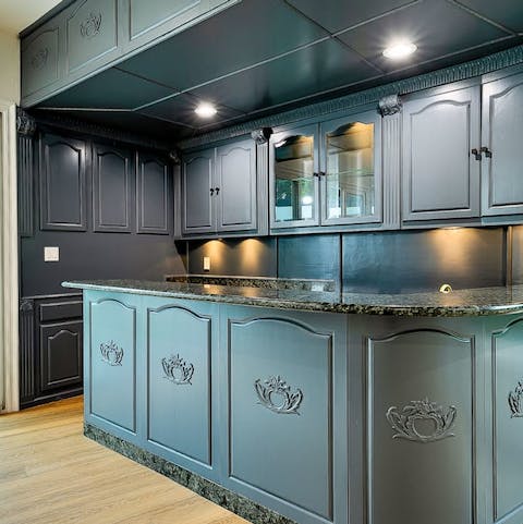 Mix a drink at the stylish wet bar