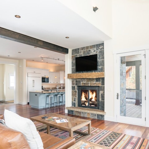 Make yourself at home in front of fireplace in the living area
