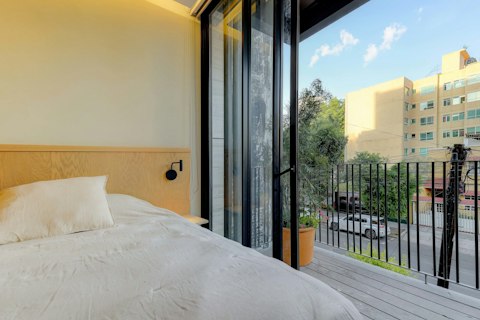 Roll out of bed and onto the balcony as the day begins