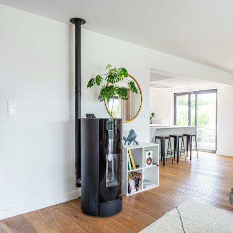 Cosy up in front of the contemporary fireplace in winter