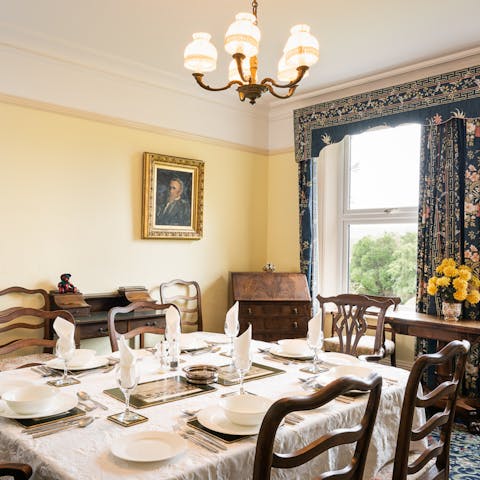 Serve meals in the formal dining room, furnished with antiques