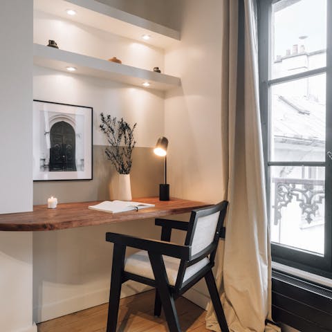 Catch up on work at the desk while in Paris