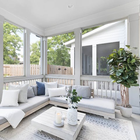 Relax with drinks and a movie on the screened porch