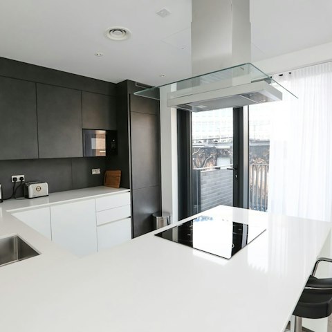 Throw open the balcony doors and prepare a culinary feast in your sleek and breezy kitchen