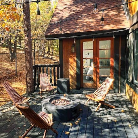 Gather around the fire pit and immerse yourself in the natural beauty of this home