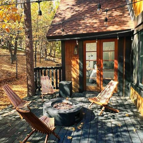 Gather around the fire pit and immerse yourself in the natural beauty of this home