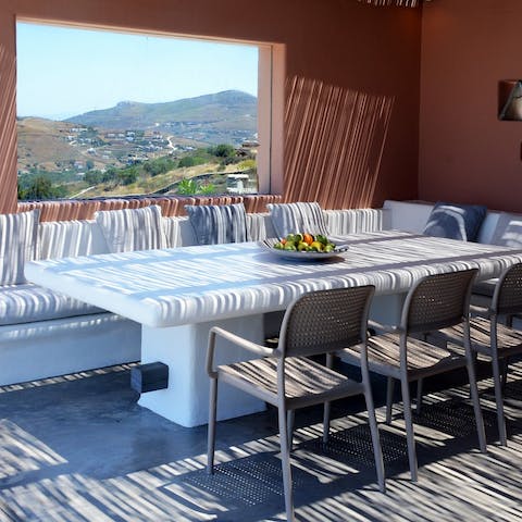 Gather around the alfresco dining area to sample some Greek cuisine