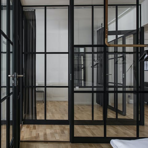 Drift off in unique glass-walled bedrooms – heavy velvet curtains are on hand for some privacy