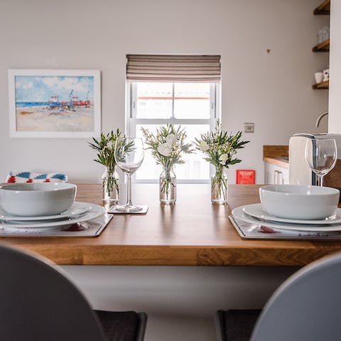 Come together for a tête-à-tête at the breakfast bar with views of the bustling high street below
