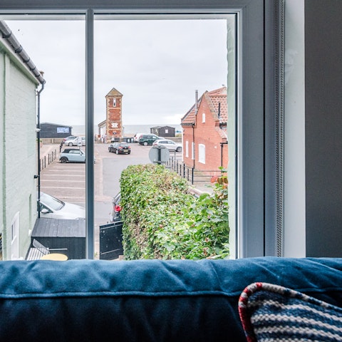 Curl up with a cuppa  on the  comfy sofa and take in the sea views from here