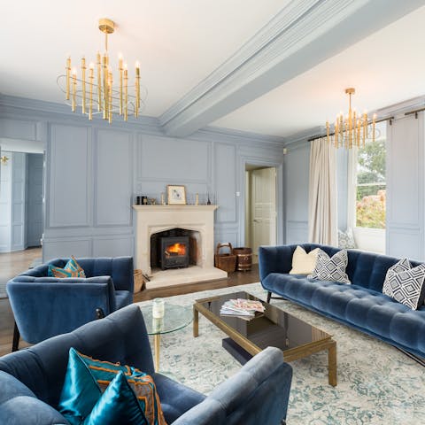 Unwind in front of the wood-burning stove in the elegant sitting room