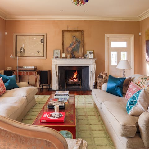 In cooler months, curl up beside the fire