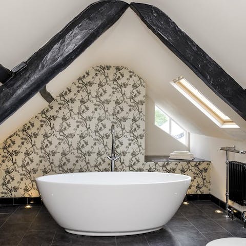 Treat yourself to well-earned soak in the freestanding bathtub