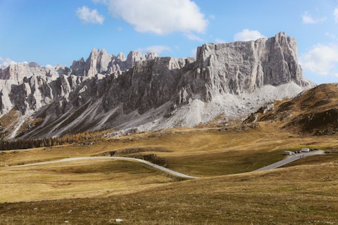 Explore breathtaking Dolomites mountain passes carved through dramatic alpine peaks