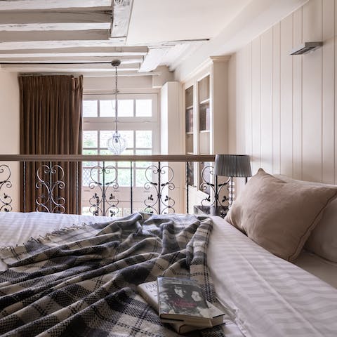 Fall asleep beneath the beams in the mezzanine bedroom