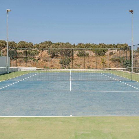 Practice your serve on the tennis court