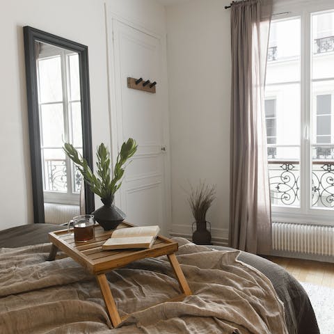 Enjoy the sunrise from the Juliet balcony in the cosy bedroom
